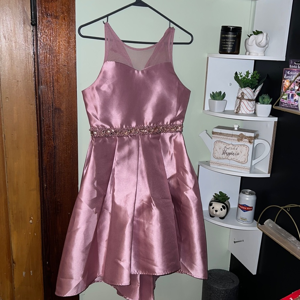 wore once for a wedding i was in! it is kids size.